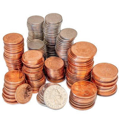a photograph of lots of bronze and silver coins stacked up